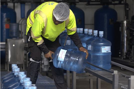 Person loading water bottles
